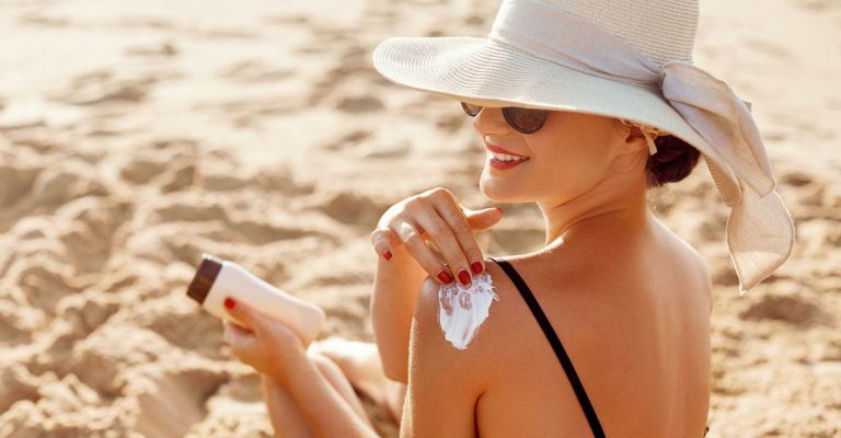 beautiful-woman-in-bikini-applying-sun-cream-on-royalty-free-image-1629767751
