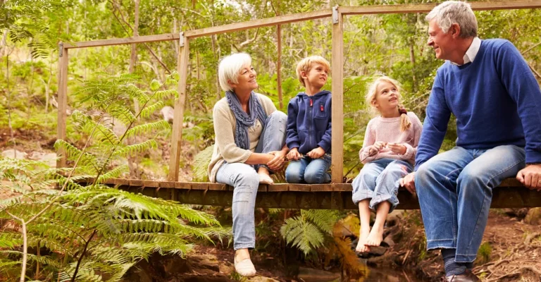 grandparents-sitting-with-grandkids-depositphotos_106179124_s.webp