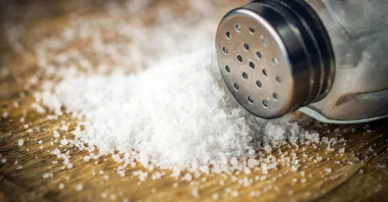 little-heap-salt-wooden-background-depositphotos_188120534_xl.webp
