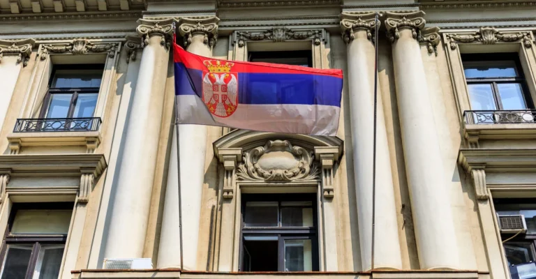serbian-national-flag-on-the-depositphotos_165630342_xl.webp