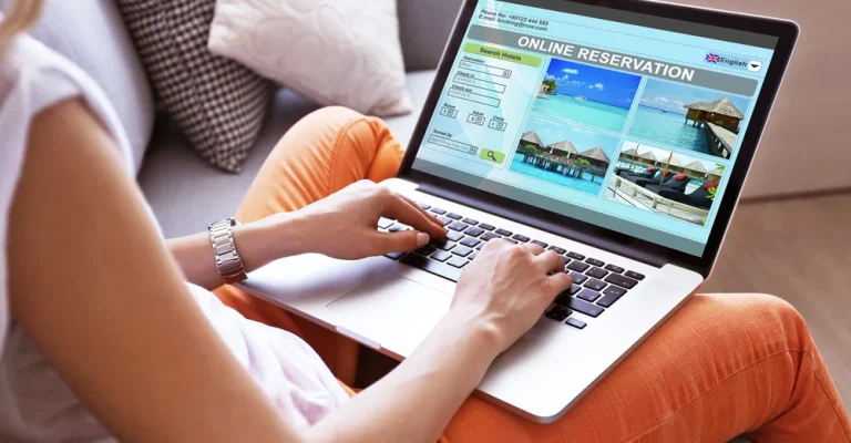 woman-using-laptop-to-book-depositphotos_80977878_s.webp